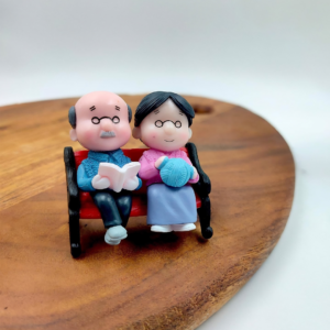 Old Aged Couple Sitting on Bench